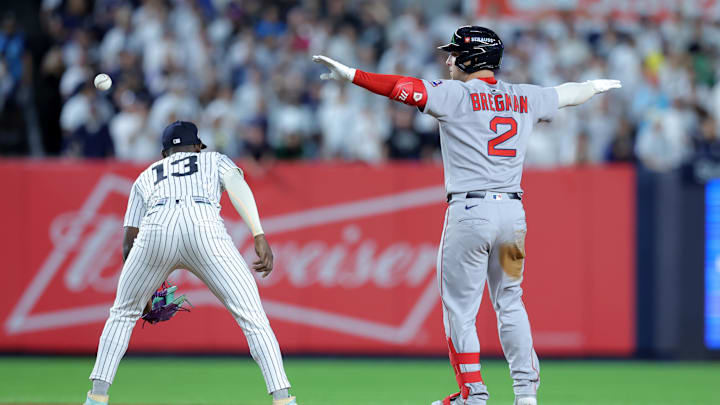 Sep 30, 2025; Bronx, New York, USA; Boston Red Sox third baseman Alex Bregman (2) celebrates his RBI double against the New York Yankees during the ninth inning of game one of the Wildcard round of the 2025 MLB playoffs at Yankee Stadium. Mandatory Credit: Brad Penner-Imagn Images Sep 30, 2025; Bronx, New York, USA; Boston Red Sox third baseman Alex Bregman (2) celebrates his RBI double against the New York Yankees during the ninth inning of game one of the Wildcard round of the 2025 MLB playoffs at Yankee Stadium. Mandatory Credit: Brad Penner-Imagn Images
