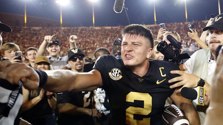 Oct 5, 2024; Nashville, Tennessee, USA;  Vanderbilt Commodores quarterback Diego Pavia celebrates with fans after defeating the Alabama Crimson Tide during the second half at FirstBank Stadium. Mandatory Credit: Butch Dill-Imagn Images