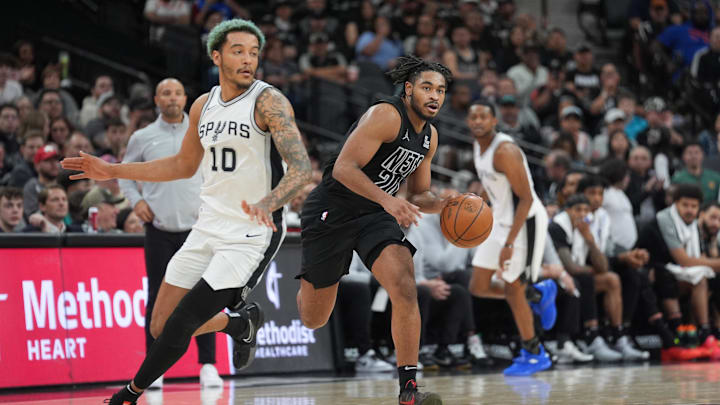 Mar 4, 2025; San Antonio, Texas, USA;  Brooklyn Nets guard Cam Thomas (24) dribbles against San Antonio Spurs forward Jeremy Sochan (10) in the second half at Frost Bank Center. Mandatory Credit: Daniel Dunn-Imagn Images