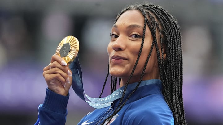 Aug 9, 2024; Saint-Denis, FRANCE; Gold medalist Tara Davis-Woodhall (USA) celebrates during the medal ceremony for the women's long jump during the Paris 2024 Olympic Summer Games at Stade de France. 
