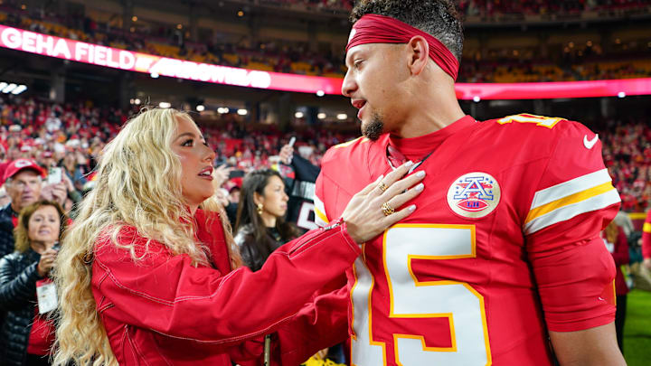 Kansas City Chiefs quarterback Patrick Mahomes (15) greets wife, Brittany Mahomes, during warmups prior to the game against the Washington Commanders at GEHA Field at Arrowhead Stadium.