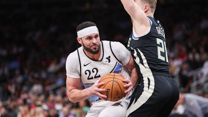 Feb 7, 2025; Atlanta, Georgia, USA; Atlanta Hawks forward Larry Nance Jr. (22) drives on Milwaukee Bucks guard AJ Green (20) in the third quarter at State Farm Arena. Mandatory Credit: Brett Davis-Imagn Images