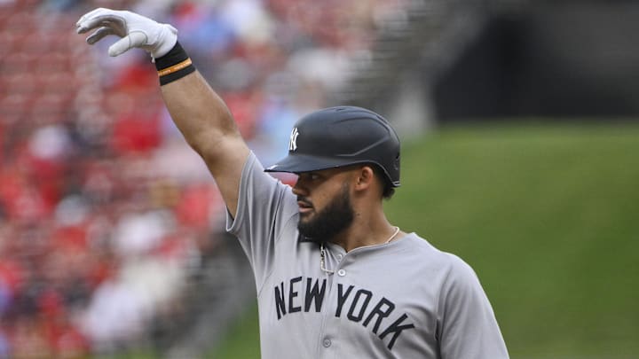 Jasson Dominguez reacts after hitting a single against the St. Louis Cardinals during the first inning at Busch Stadium.