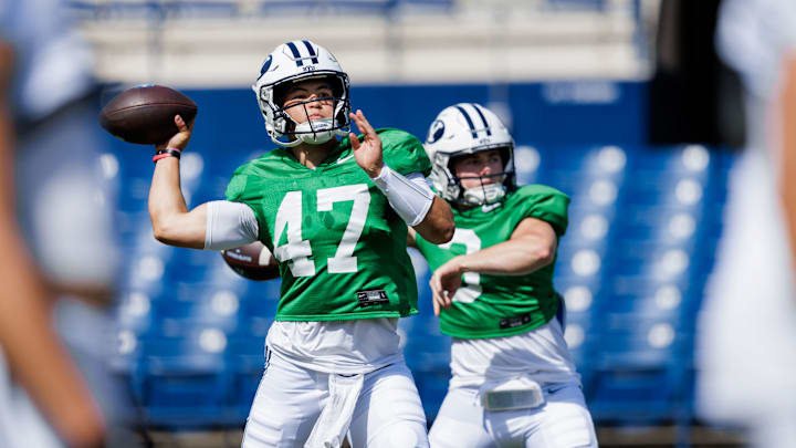 BYU quarterbacks Bear Bachmeier and McCae Hillstead warm up for the first scrimmage of Fall Camp
