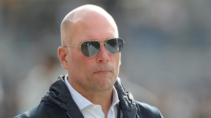 Nov 17, 2024; Pittsburgh, Pennsylvania, USA;  Baltimore Ravens general manager Eric DeCosta watches warm ups against the Pittsburgh Steelers at Acrisure Stadium. Mandatory Credit: Charles LeClaire-Imagn Images