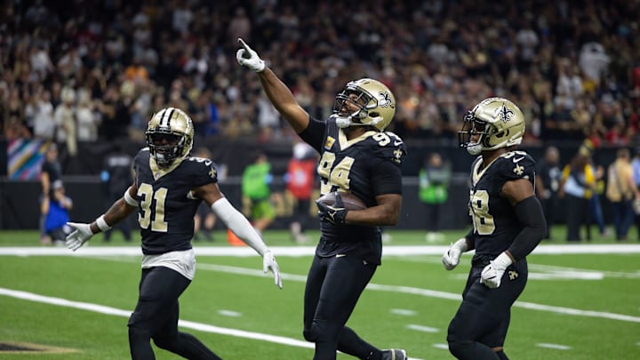 Oct 13, 2024; New Orleans, Louisiana, USA; New Orleans Saints defensive end Cameron Jordan (94) reacts to intercepting the pass of Tampa Bay Buccaneers quarterback Baker Mayfield (6) during the first half at Caesars Superdome. Mandatory Credit: Stephen Lew-Imagn Images Oct 13, 2024; New Orleans, Louisiana, USA; New Orleans Saints defensive end Cameron Jordan (94) reacts to intercepting the pass of Tampa Bay Buccaneers quarterback Baker Mayfield (6) during the first half at Caesars Superdome. Mandatory Credit: Stephen Lew-Imagn Images