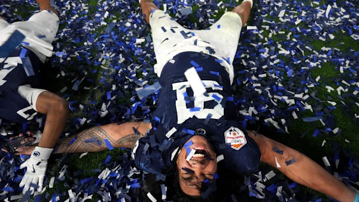 Penn State Nittany Lions defensive lineman Dvon J-Thomas (91) celebrates after their 31-14 win over the Boise State Broncos in the Vrbo Fiesta Bowl at State Farm Stadium.