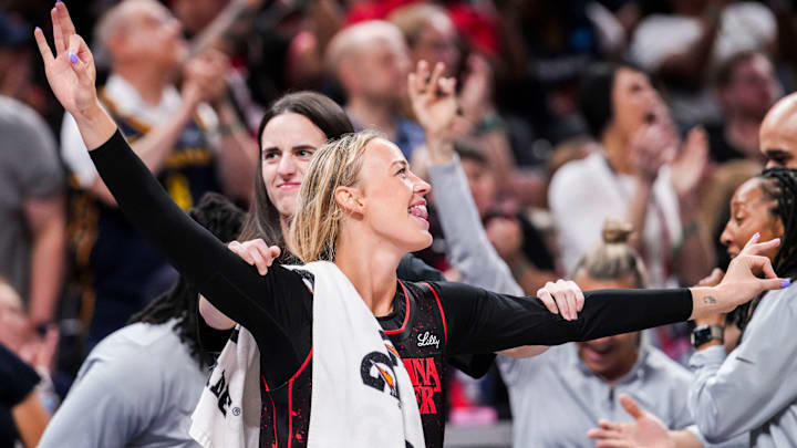Indiana Fever guard Sophie Cunningham (8) and Indiana Fever guard Caitlin Clark (22) celebrate from the bench Saturday, Aug. 9, 2025, during a game between the Indiana Fever and the Chicago Sky at Gainbridge Fieldhouse in Indianapolis.