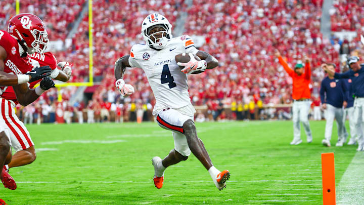 Auburn Tigers wide receiver Malcolm Simmons scores a touchdown during the second half against the Oklahoma Sooners at Gaylord Family-Oklahoma Memorial Stadium. Auburn Tigers wide receiver Malcolm Simmons scores a touchdown during the second half against the Oklahoma Sooners at Gaylord Family-Oklahoma Memorial Stadium.