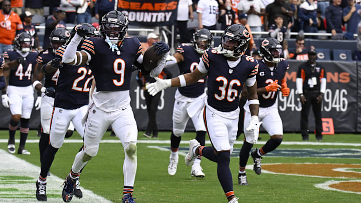 Sep 29, 2024; Chicago, Illinois, USA;  Chicago Bears safety Jaquan Brisker (9) celebrates with teammates after intercepting a pass at the end of the second half at Soldier Field. Mandatory Credit: Matt Marton-Imagn Images