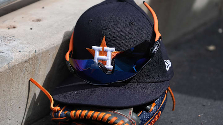 General view of a Houston Astros cap, and glove.