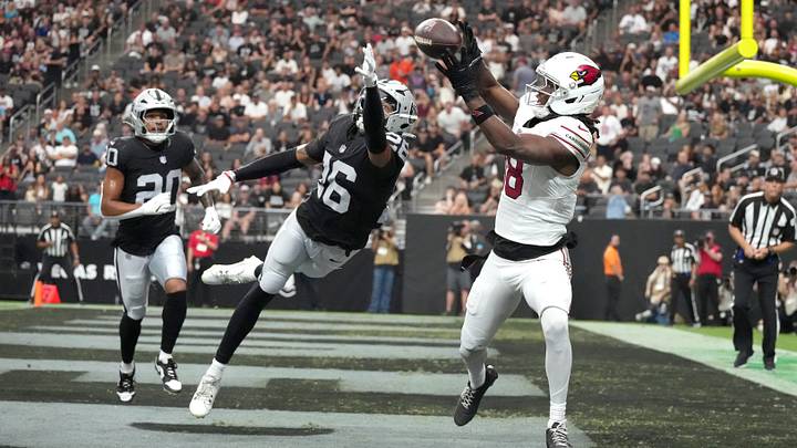 Aug 13, 2026; Paradise, Nevada, USA; Arizona Cardinals wide receiver Marvin Harrison Jr. (18) catches a 7-yard touchdown pass against Las Vegas Raiders cornerback Darien Porter (26)lin the first half at Allegiant Stadium. Mandatory Credit: Kirby Lee-Imagn Images Aug 13, 2026; Paradise, Nevada, USA; Arizona Cardinals wide receiver Marvin Harrison Jr. (18) catches a 7-yard touchdown pass against Las Vegas Raiders cornerback Darien Porter (26)lin the first half at Allegiant Stadium. Mandatory Credit: Kirby Lee-Imagn Images