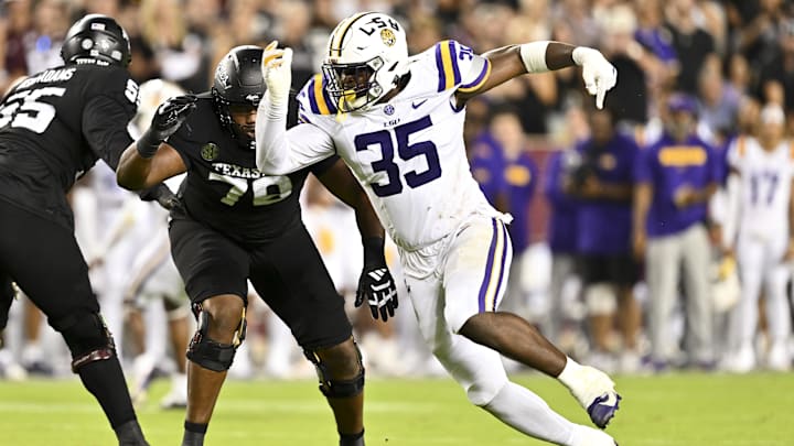 Oct 26, 2024; College Station, Texas, USA; LSU Tigers defensive end Sai'vion Jones (35) defends in coverage during the third quarter against the Texas A&M Aggies. The Aggies defeated the Tigers 38-23; at Kyle Field. Mandatory Credit: Maria Lysaker-Imagn Images.  