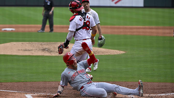 Sep 12, 2024; St. Louis, Missouri, USA;  Cincinnati Reds right fielder Jake Fraley (27) slides safely in at home to score against the St. Louis Cardinals during the sixth inning at Busch Stadium. Mandatory Credit: Jeff Curry-Imagn Images