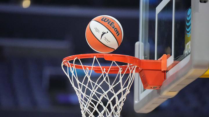 Aug 15, 2024; Los Angeles, California, USA; A WNBA official Wilson Evo NXT basketball approaches the rim and net at Crypto.com Arena. Mandatory Credit: Kirby Lee-Imagn Images