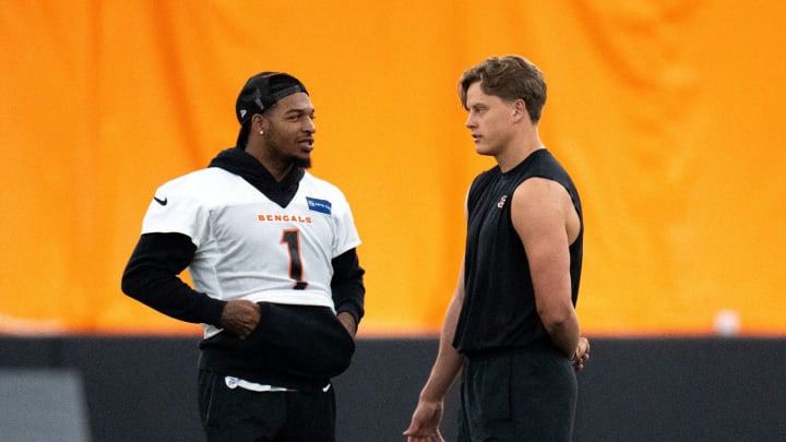 Ja'Marr Chase and Joe Burrow talk during mandatory minicamp