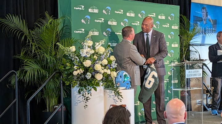 New Football Head Coach Will Hall Shakes AD David Harris' Hands New Football Head Coach Will Hall Shakes AD David Harris' Hands