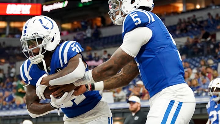 Aug 16, 2025; Indianapolis, Indiana, USA; Indianapolis Colts running back Tyler Goodson (31) receives a handoff from Indianapolis Colts quarterback Anthony Richardson Sr. (5) during warmups prior to the game against the Green Bay Packers at Lucas Oil Stadium. Mandatory Credit: Robert Goddin-Imagn Images Aug 16, 2025; Indianapolis, Indiana, USA; Indianapolis Colts running back Tyler Goodson (31) receives a handoff from Indianapolis Colts quarterback Anthony Richardson Sr. (5) during warmups prior to the game against the Green Bay Packers at Lucas Oil Stadium. Mandatory Credit: Robert Goddin-Imagn Images