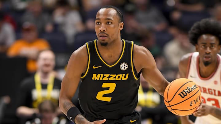 Mar 13, 2024; Nashville, TN, USA;  Missouri Tigers guard Tamar Bates (2) dribbles against the Georgia Bulldogs during the first half at Bridgestone Arena. Mandatory Credit: Steve Roberts-Imagn Images