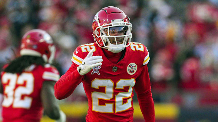 Dec 21, 2024; Kansas City, Missouri, USA; Kansas City Chiefs cornerback Trent McDuffie (22) celebrates after an interception during the first half against the Houston Texans at GEHA Field at Arrowhead Stadium. Mandatory Credit: Jay Biggerstaff-Imagn Images