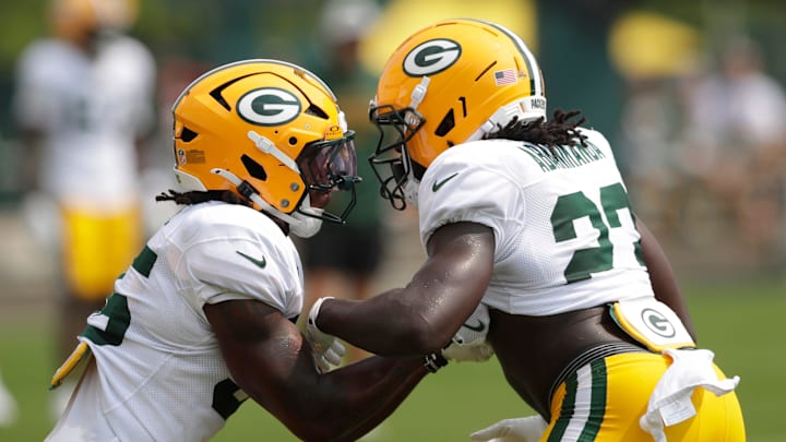 Green Bay Packers running backs Jalen White (35) and Israel Abanikanda (23) participate in drills on Tuesday. Green Bay Packers running backs Jalen White (35) and Israel Abanikanda (23) participate in drills on Tuesday.