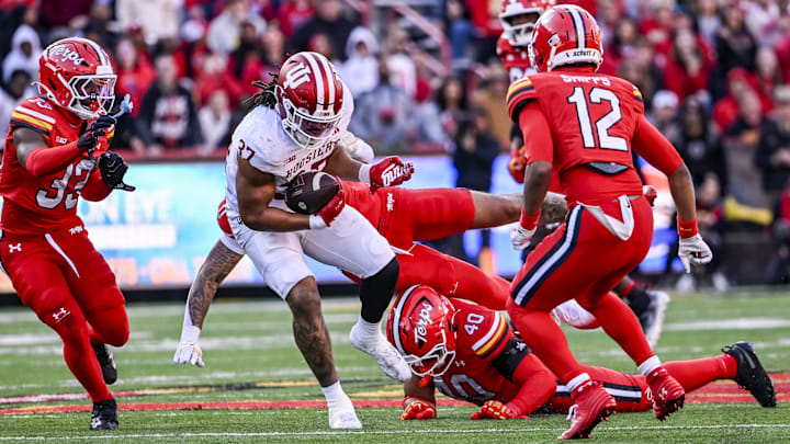 Nov 1, 2025; College Park, Maryland, USA; Maryland Terrapins defensive lineman Nahsir Taylor (40) makes a tackle attempt as safety Jayden Shipps (12) pursues the ballcarrier during the second quarter at SECU Stadium.