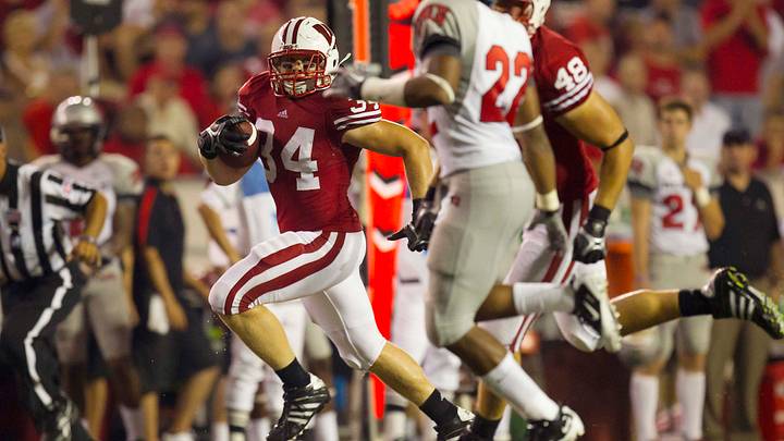 Sep 1, 2011; Madison, WI, USA; Wisconsin Badgers fullback Bradie Ewing (34) rushes with the football during the third quarter against the UNLV Rebels at Camp Randall Stadium. Mandatory Credit: Jeff Hanisch-USA TODAY Sports Sep 1, 2011; Madison, WI, USA; Wisconsin Badgers fullback Bradie Ewing (34) rushes with the football during the third quarter against the UNLV Rebels at Camp Randall Stadium. Mandatory Credit: Jeff Hanisch-USA TODAY Sports