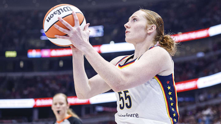 Jul 27, 2025; Chicago, Illinois, USA; Indiana Fever forward Chloe Bibby (55) shoots against the Chicago Sky during the first half at United Center. Mandatory Credit: Kamil Krzaczynski-Imagn Images