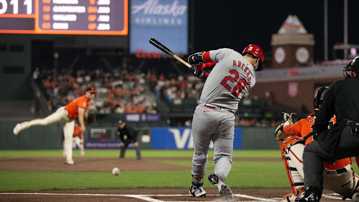 Sep 27, 2024; San Francisco, California, USA; St. Louis Cardinals third baseman Nolan Arenado (28) hits an RBI single off San Francisco Giants starting pitcher Landen Roupp (65) during the first inning at Oracle Park. Mandatory Credit: D. Ross Cameron-Imagn Images Sep 27, 2024; San Francisco, California, USA; St. Louis Cardinals third baseman Nolan Arenado (28) hits an RBI single off San Francisco Giants starting pitcher Landen Roupp (65) during the first inning at Oracle Park. Mandatory Credit: D. Ross Cameron-Imagn Images
