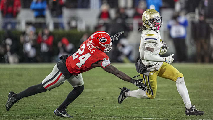 Nov 29, 2024; Athens, Georgia, USA; Georgia Tech Yellow Jackets wide receiver Eric Singleton Jr. (2) runs against Georgia Bulldogs defensive back Malaki Starks (24) during the second half at Sanford Stadium. Mandatory Credit: Dale Zanine-Imagn Images