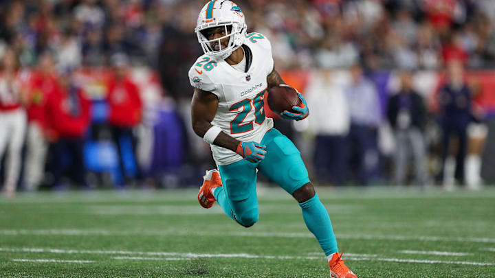 Sep 17, 2023; Foxborough, Massachusetts, USA; Miami Dolphins running back Salvon Ahmed (26) runs the ball during the first half against the New England Patriots at Gillette Stadium. Mandatory Credit: Paul Rutherford-Imagn Images Sep 17, 2023; Foxborough, Massachusetts, USA; Miami Dolphins running back Salvon Ahmed (26) runs the ball during the first half against the New England Patriots at Gillette Stadium. Mandatory Credit: Paul Rutherford-Imagn Images