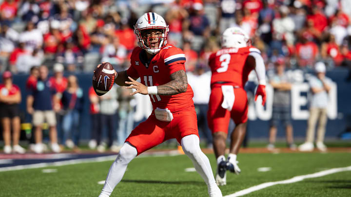 Oct 19, 2024; Tucson, Arizona, USA; Arizona Wildcats quarterback Noah Fifita (11) against the Colorado Buffalos at Arizona Stadium. Mandatory Credit: Mark J. Rebilas-Imagn Images Oct 19, 2024; Tucson, Arizona, USA; Arizona Wildcats quarterback Noah Fifita (11) against the Colorado Buffalos at Arizona Stadium. Mandatory Credit: Mark J. Rebilas-Imagn Images