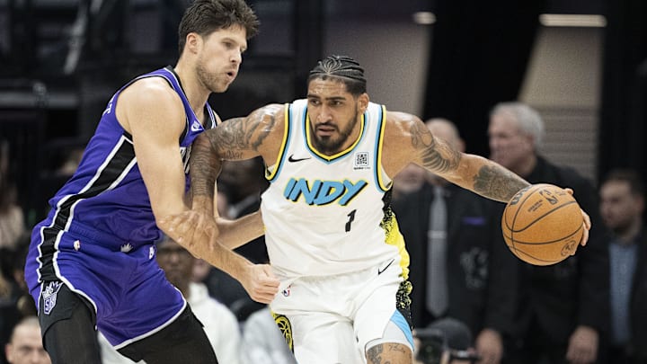 December 22, 2024; Sacramento, California, USA; Indiana Pacers forward Obi Toppin (1) dribbles the basketball against Sacramento Kings forward Doug McDermott (7) during the first quarter at Golden 1 Center. Mandatory Credit: Kyle Terada-Imagn Images