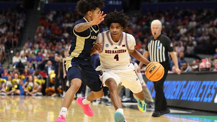 Mar 20, 2026; Tampa, FL, USA; Texas Tech Red Raiders guard Christian Anderson (4) drives against Akron Zips guard Sharron Young (3) in the second half during a first round game of the men's 2026 NCAA Tournament at Benchmark International Arena. Mandatory Credit: Nathan Ray Seebeck-Imagn Images Mar 20, 2026; Tampa, FL, USA; Texas Tech Red Raiders guard Christian Anderson (4) drives against Akron Zips guard Sharron Young (3) in the second half during a first round game of the men's 2026 NCAA Tournament at Benchmark International Arena. Mandatory Credit: Nathan Ray Seebeck-Imagn Images