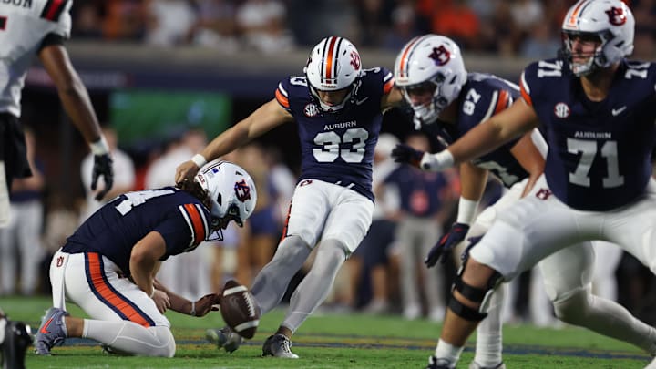 Sep 6, 2025; Auburn, Alabama, USA;  Auburn Tigers place kicker Towns McGough (33) attempts a field goal during the second quarter against the Ball State Cardinals at Jordan-Hare Stadium. Mandatory Credit: John Reed-Imagn Images