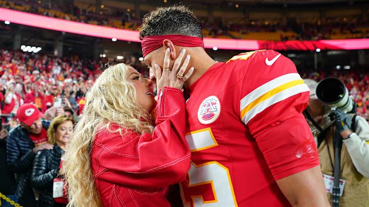 Oct 27, 2025; Kansas City, Missouri, USA; Kansas City Chiefs quarterback Patrick Mahomes (15) greets wife, Brittany Mahomes, during warmups prior to the game against the Washington Commanders at GEHA Field at Arrowhead Stadium.
