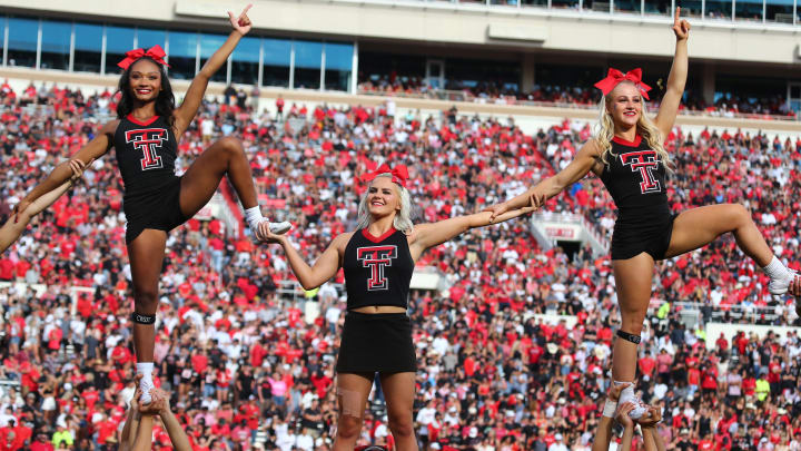 Sep 30, 2023; Lubbock, Texas, USA; Members of the Texas Tech Red Raiders cheerleading squad perform in the second half during the game against the Houston Cougars at Jones AT&T Stadium and Cody Campbell Field. Sep 30, 2023; Lubbock, Texas, USA; Members of the Texas Tech Red Raiders cheerleading squad perform in the second half during the game against the Houston Cougars at Jones AT&T Stadium and Cody Campbell Field.