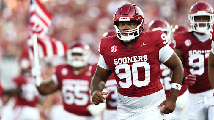 Oklahoma defensive tackle Trent Wilson runs out of the tunnel.