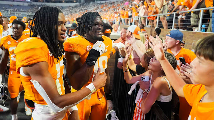 Tennessee wide receiver Chris Brazzell II (17) and Tennessee defensive lineman Joshua Josephs (19) celebrate with fans after the Vols defeated Mississippi State in overtime at Davis Wade Stadium in Starkville, Miss., on Sept. 27, 2025.