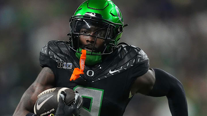 Oregon Ducks defensive back Nikko Reed (9) rushes up the field after an interception Saturday, Dec. 7, 2024, during the Big Ten Championship game at Lucas Oil Stadium in Indianapolis. Oregon Ducks defensive back Nikko Reed (9) rushes up the field after an interception Saturday, Dec. 7, 2024, during the Big Ten Championship game at Lucas Oil Stadium in Indianapolis.
