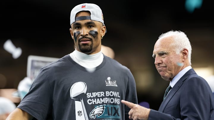 Feb 9, 2025; New Orleans, LA, USA; Philadelphia Eagles quarterback Jalen Hurts (left) celebrates with owner Jeffrey Lurie after defeating the Kansas City Chiefs to win Super Bowl LIX at Ceasars Superdome. Mandatory Credit: Mark J. Rebilas-Imagn Images