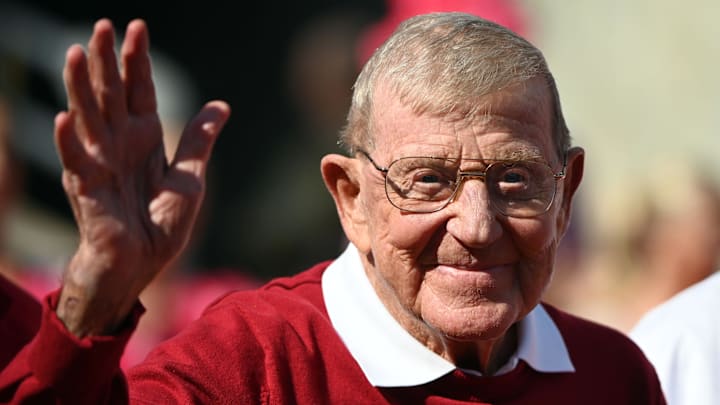 Former North Carolina State Wolfpack head coach Lou Holtz is honored along with his 1973 football team.