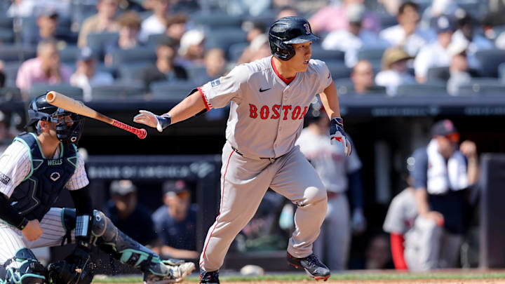 Sep 14, 2024; Bronx, New York, USA; Boston Red Sox designated hitter Masataka Yoshida (7) follows through on a two run single against the New York Yankees during the fifth inning at Yankee Stadium. Mandatory Credit: Brad Penner-Imagn Images