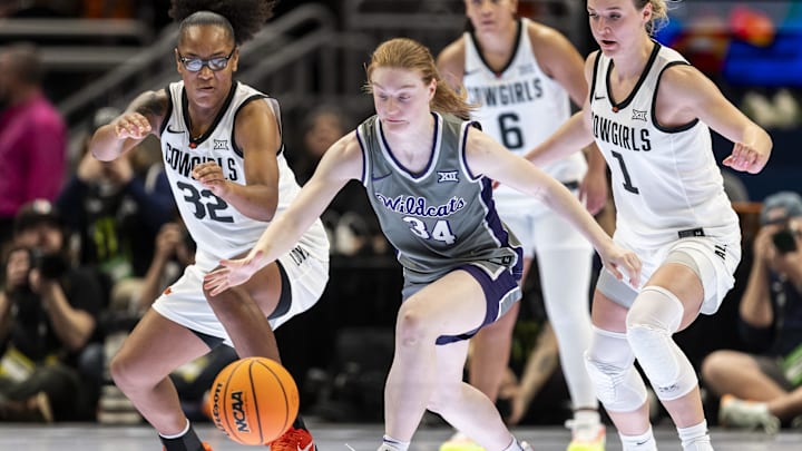 Mar 6, 2026; Kansas City, MO, USA;  Kansas State Wildcats guard Tess Heal (34) chases down a loose ball ahead of Oklahoma State Cowgirls guard Amari Whiting (1) and guard Stailee Heard (32) during the first half at T-Mobile Center. 