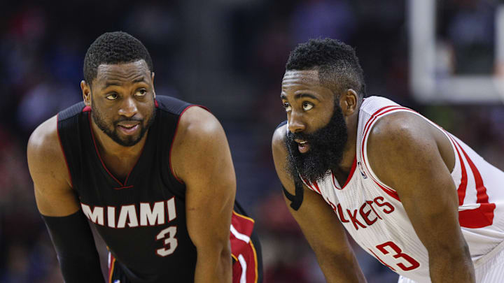 Jan 3, 2015; Houston, TX, USA; Miami Heat guard Dwyane Wade (3) and Houston Rockets guard James Harden (13) talk during the second quarter at Toyota Center. Mandatory Credit: Troy Taormina-Imagn Images
