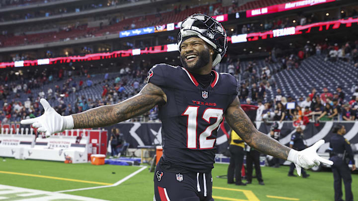 Dec 15, 2024; Houston, Texas, USA; Houston Texans wide receiver Nico Collins (12) smiles after the game against the Miami Dolphins at NRG Stadium. Mandatory Credit: Troy Taormina-Imagn Images
