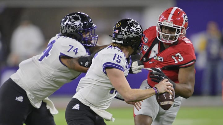 Jan 9, 2023; Inglewood, CA, USA; TCU Horned Frogs quarterback Max Duggan (15) is pressured by Georgia Bulldogs defensive lineman Mykel Williams (13) during the second half in the CFP national championship game at SoFi Stadium. Mandatory Credit: Jayne Kamin-Oncea-Imagn Images Jan 9, 2023; Inglewood, CA, USA; TCU Horned Frogs quarterback Max Duggan (15) is pressured by Georgia Bulldogs defensive lineman Mykel Williams (13) during the second half in the CFP national championship game at SoFi Stadium. Mandatory Credit: Jayne Kamin-Oncea-Imagn Images