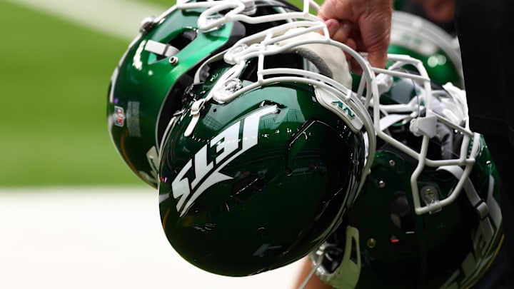 Oct 6, 2024; Tottenham, ENG; New York Jets helmets are held by staff before the match against Minnesota Vikings at Tottenham Hotspur Stadium. Mandatory Credit: Shaun Brooks-Imagn Images