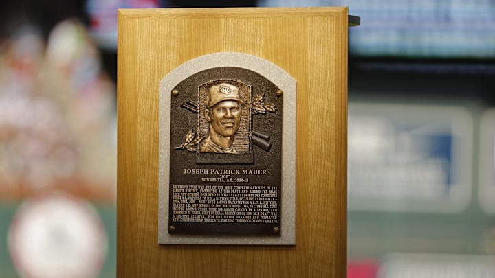 Aug 3, 2024; Minneapolis, Minnesota, USA; The plaque for Minnesota Twins former player Joe Mauer from his recent induction into the Baseball Hall of Fame rests on the field for a ceremony before a game against the Chicago White Sox at Target Field. Mandatory Credit: Bruce Kluckhohn-Imagn Images Aug 3, 2024; Minneapolis, Minnesota, USA; The plaque for Minnesota Twins former player Joe Mauer from his recent induction into the Baseball Hall of Fame rests on the field for a ceremony before a game against the Chicago White Sox at Target Field. Mandatory Credit: Bruce Kluckhohn-Imagn Images