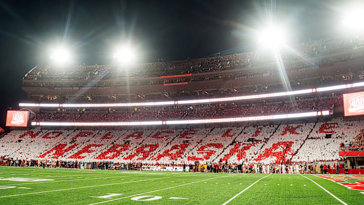 Sep 20, 2024; Lincoln, Nebraska, USA; Fans hold cards to commemorate the 400th consecutive sellout after the first quarter between the Nebraska Cornhuskers and the Illinois Fighting Illini at Memorial Stadium. Sep 20, 2024; Lincoln, Nebraska, USA; Fans hold cards to commemorate the 400th consecutive sellout after the first quarter between the Nebraska Cornhuskers and the Illinois Fighting Illini at Memorial Stadium.